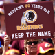 A Washington Redskins fan holds up a sign to keep the Redskins name before they play the Jacksonville Jaguars at FedExField on September 14, 2014 in Landover, Maryland.